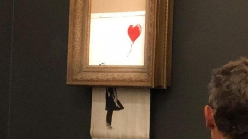 Obra do artista plástico Banksy se autodestrói após venda milionária-0