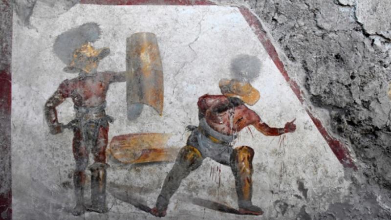 Pintura que retrata luta sangrenta é encontrada em taberna de gladiadores em Pompeia-0